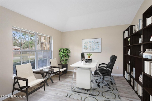 office with light hardwood / wood-style floors