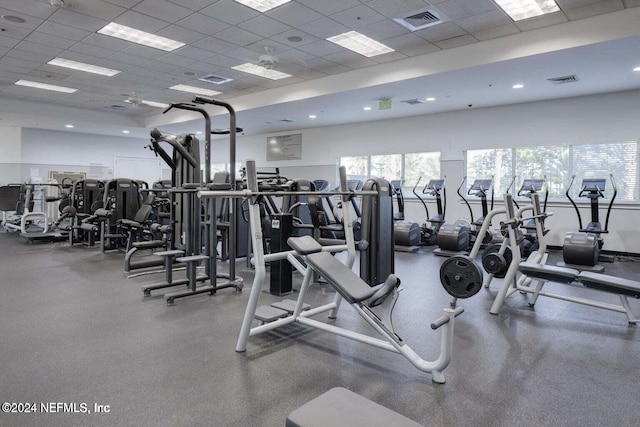 exercise room with a drop ceiling