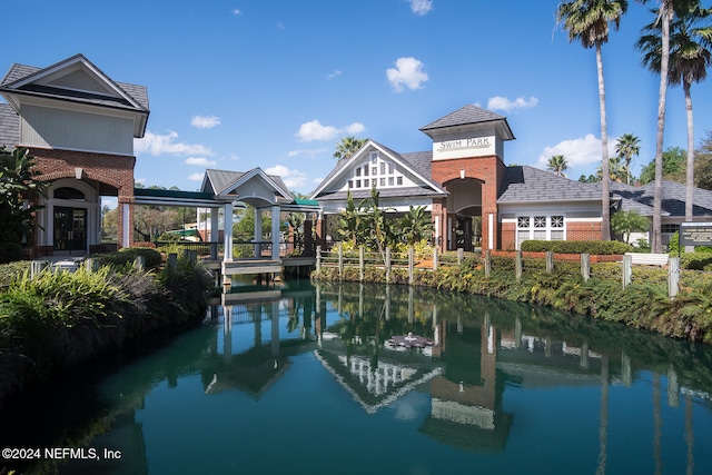 view of pool featuring a water view