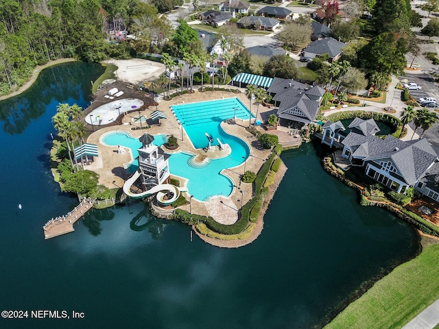 birds eye view of property featuring a water view