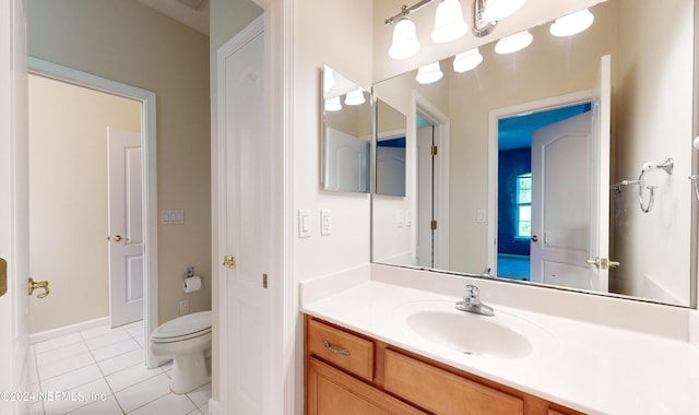 bathroom featuring tile patterned floors, vanity, and toilet