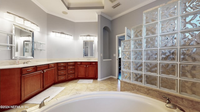 bathroom featuring vanity, a tub to relax in, and crown molding