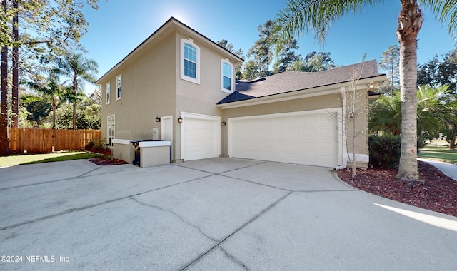 view of side of home with a garage