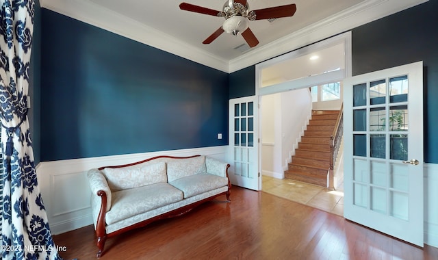 unfurnished room featuring crown molding, french doors, ceiling fan, and hardwood / wood-style flooring