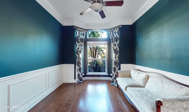 unfurnished room featuring ceiling fan, dark wood-type flooring, and ornamental molding