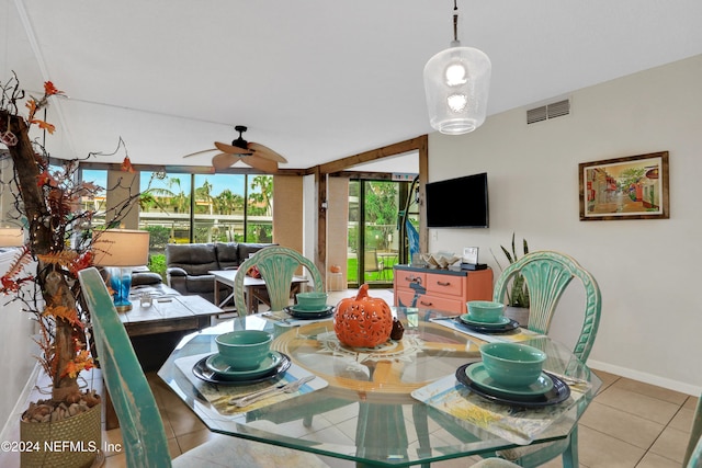 dining room featuring ceiling fan and light tile patterned floors