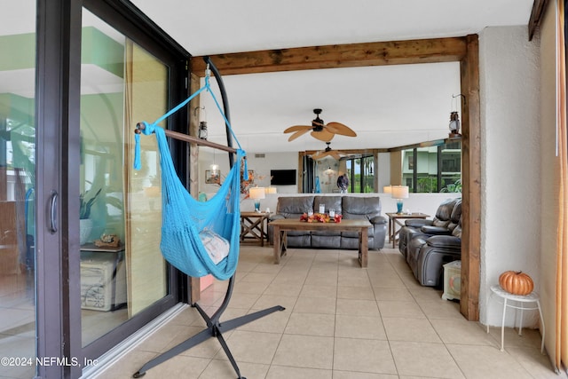 sunroom / solarium featuring ceiling fan