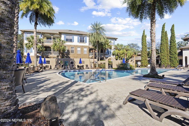 view of swimming pool with a patio area