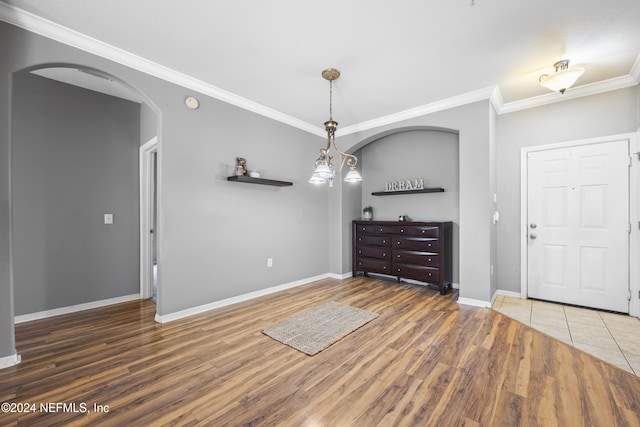 interior space featuring dark hardwood / wood-style floors and ornamental molding