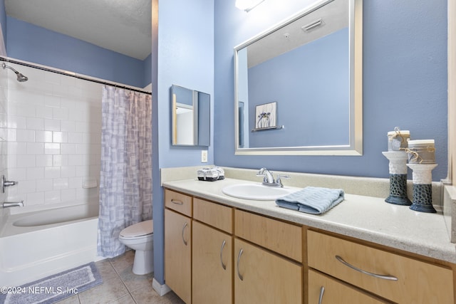 full bathroom with tile patterned floors, vanity, shower / tub combo, and toilet