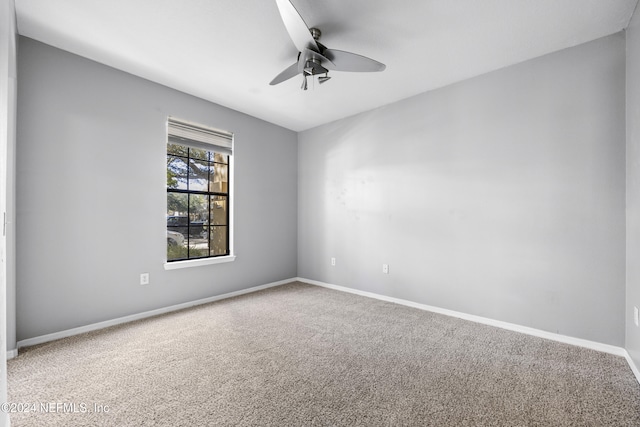 carpeted empty room with ceiling fan