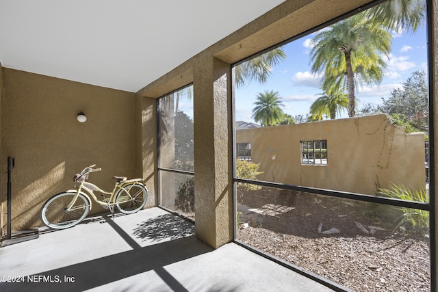 unfurnished sunroom featuring a healthy amount of sunlight