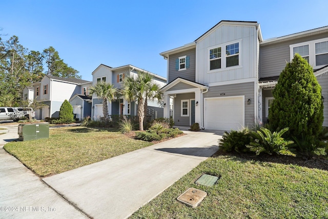 view of front of property with a garage and a front yard