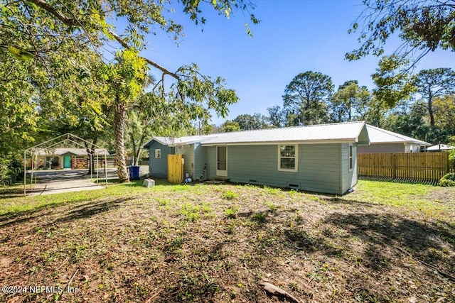 rear view of property with a gazebo