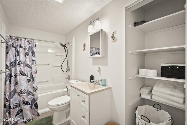 full bathroom featuring vanity, shower / bath combination with curtain, toilet, and a textured ceiling