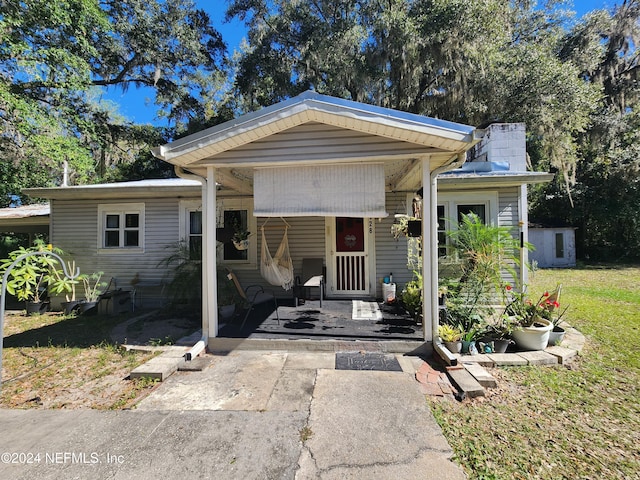 view of front facade with a storage shed