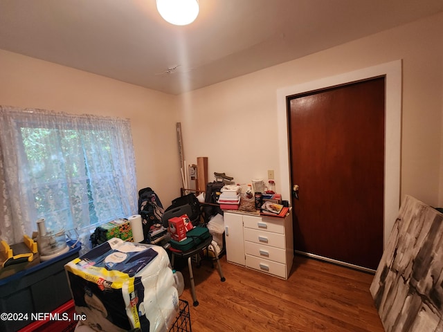 office with hardwood / wood-style flooring