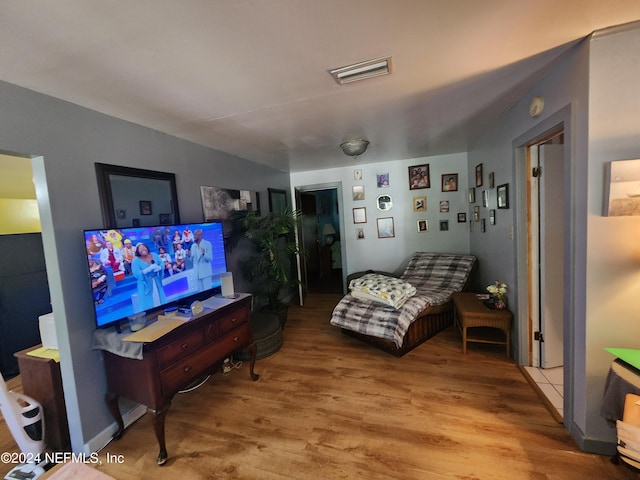 living room with light hardwood / wood-style flooring