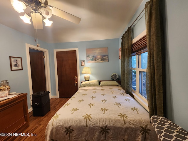 bedroom featuring ceiling fan and dark hardwood / wood-style flooring