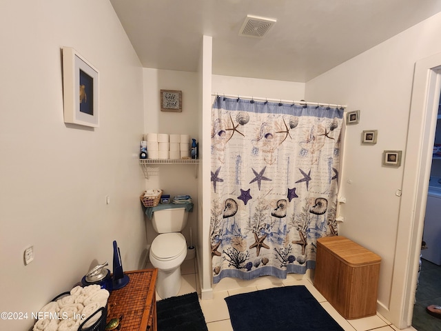 bathroom with tile patterned flooring, a shower with shower curtain, and toilet