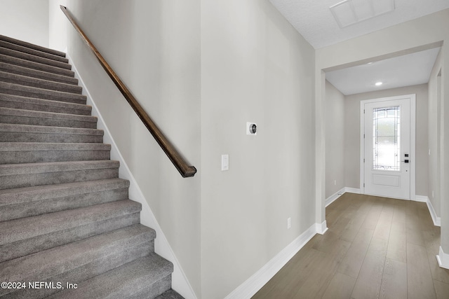 foyer entrance with hardwood / wood-style floors