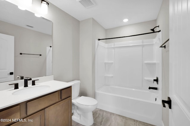 full bathroom featuring vanity, bathing tub / shower combination, and toilet