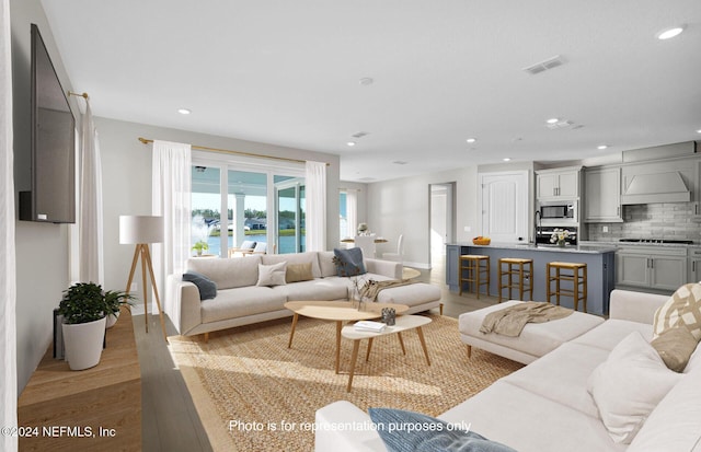 living room with light hardwood / wood-style flooring