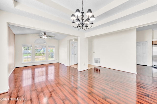 interior space featuring a textured ceiling, ceiling fan with notable chandelier, vaulted ceiling, and hardwood / wood-style flooring