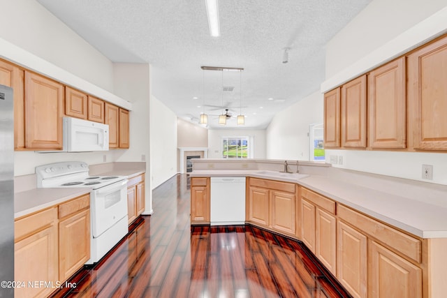 kitchen with kitchen peninsula, dark hardwood / wood-style flooring, a textured ceiling, white appliances, and light brown cabinets