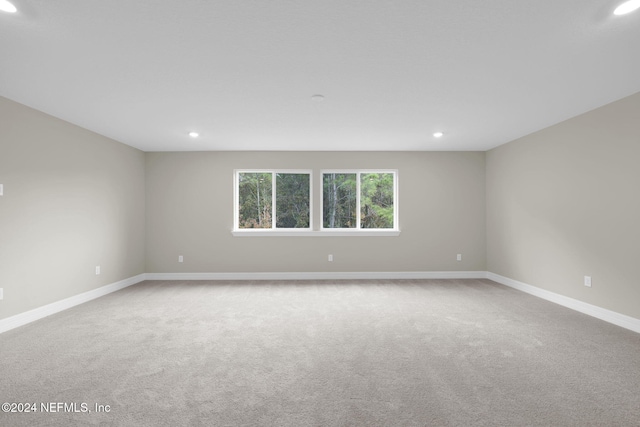 empty room featuring light colored carpet