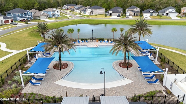 view of pool featuring a water view