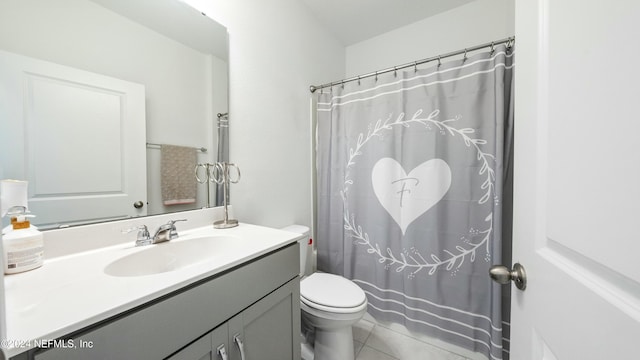 bathroom with tile patterned flooring, vanity, toilet, and a shower with shower curtain