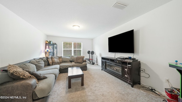 carpeted living room with a fireplace