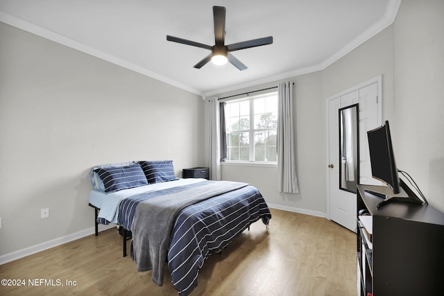 bedroom with ceiling fan, ornamental molding, and light wood-type flooring