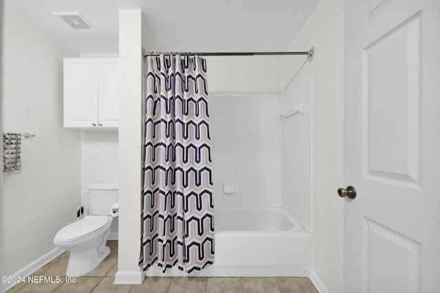 bathroom featuring tile patterned floors, shower / bathtub combination with curtain, and toilet