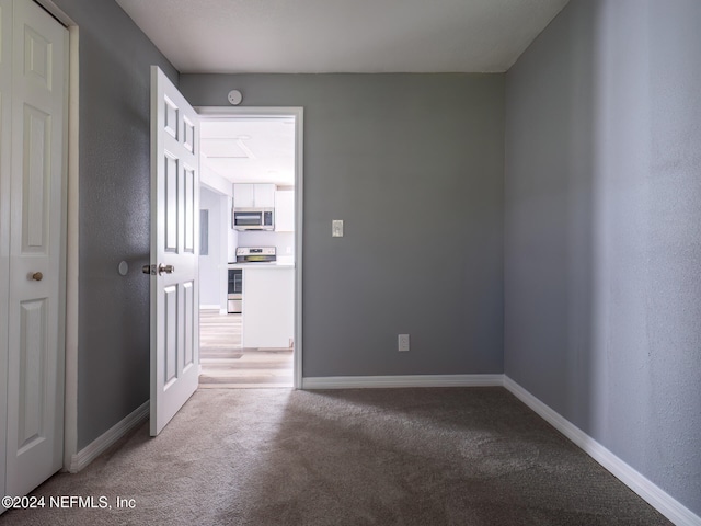 spare room featuring carpet floors