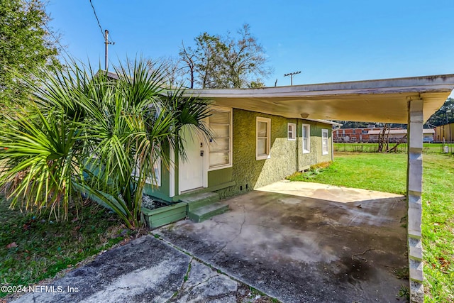 view of patio / terrace with a carport