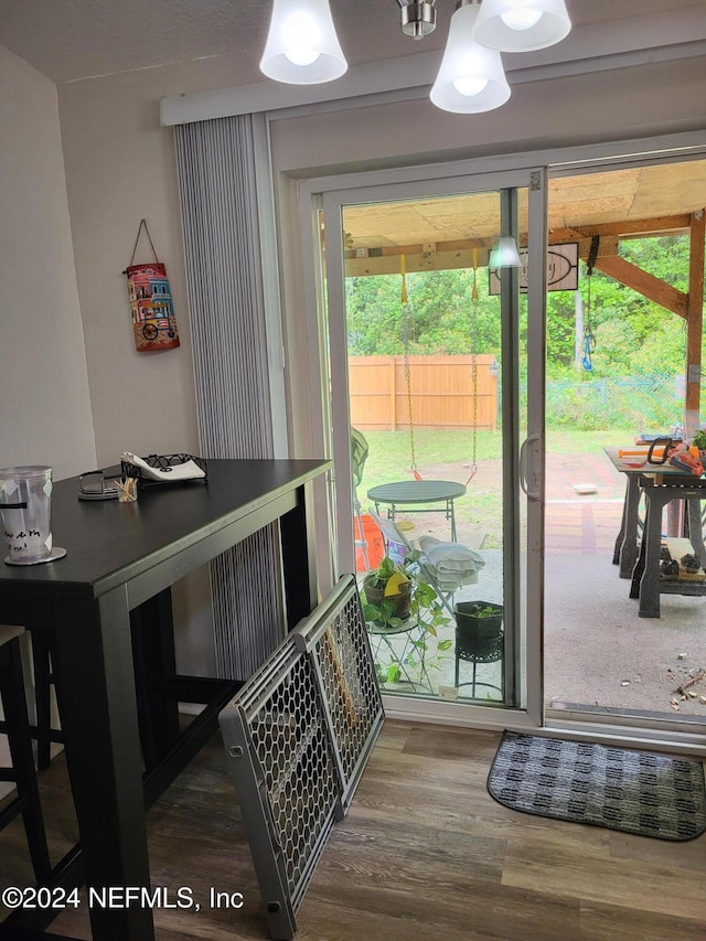 doorway to outside featuring hardwood / wood-style floors