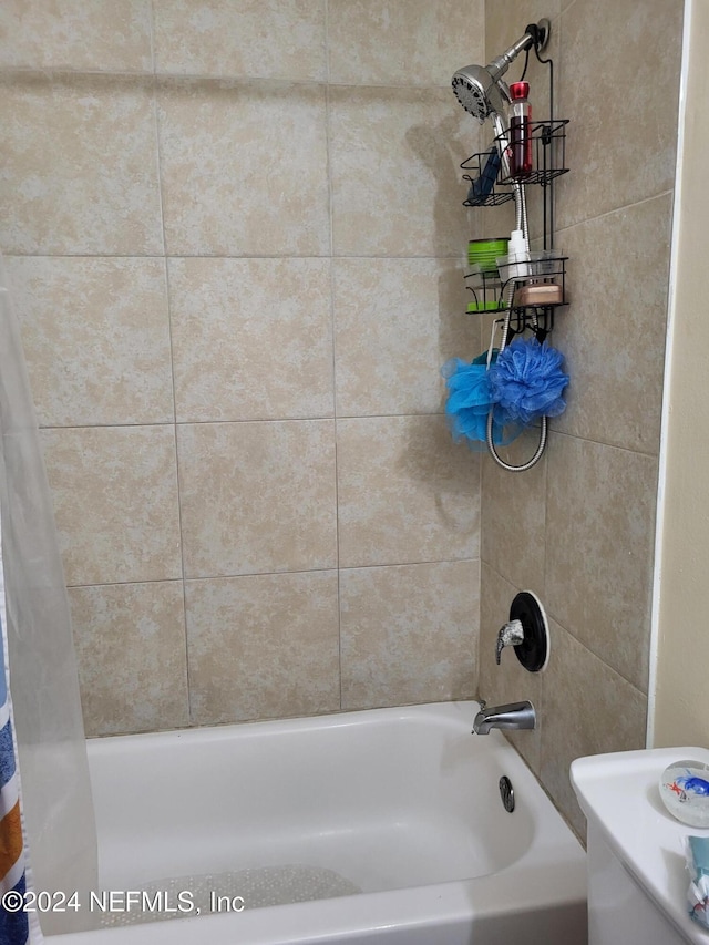 bathroom featuring shower / bath combo with shower curtain