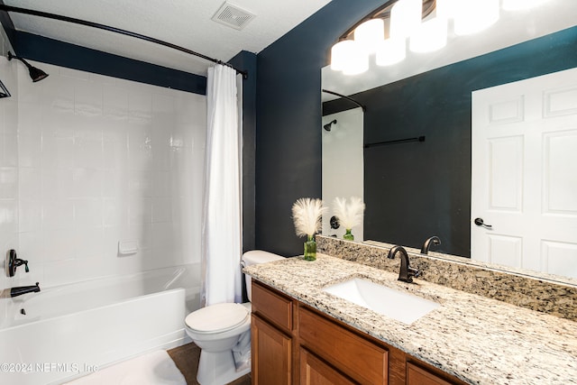 full bathroom with vanity, toilet, a textured ceiling, and shower / tub combo with curtain