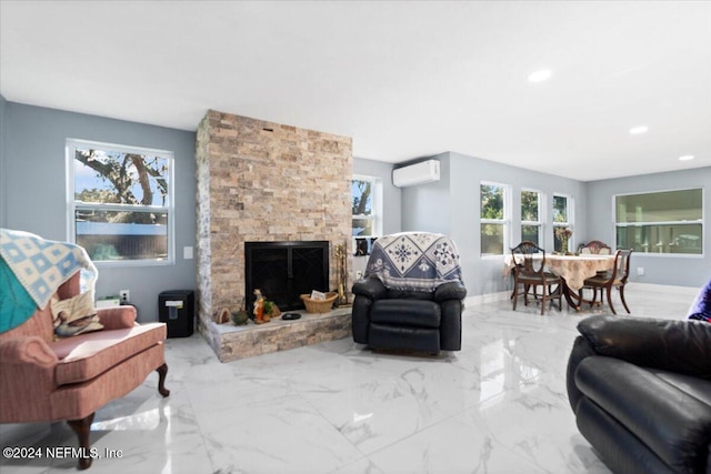 living room featuring an AC wall unit and a stone fireplace