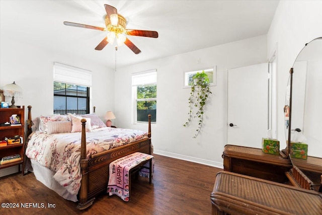 bedroom featuring dark hardwood / wood-style flooring and ceiling fan