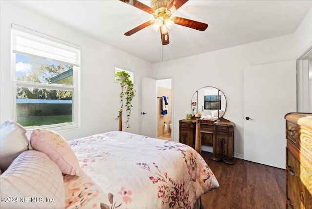 bedroom with ceiling fan, dark hardwood / wood-style flooring, and ensuite bathroom