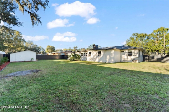 view of yard with a storage unit