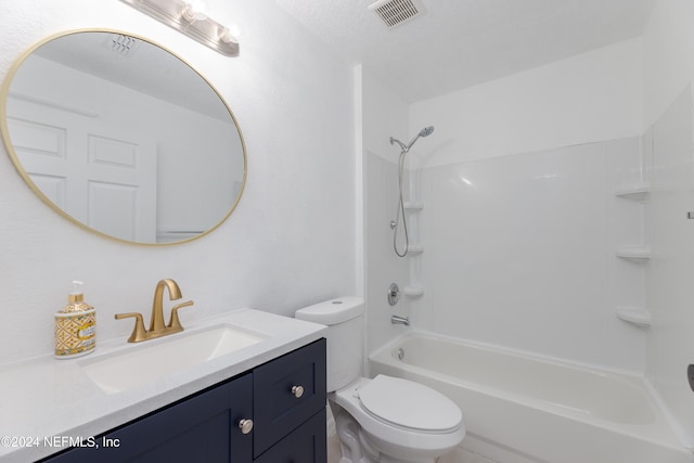 full bathroom featuring a textured ceiling, vanity, toilet, and shower / washtub combination