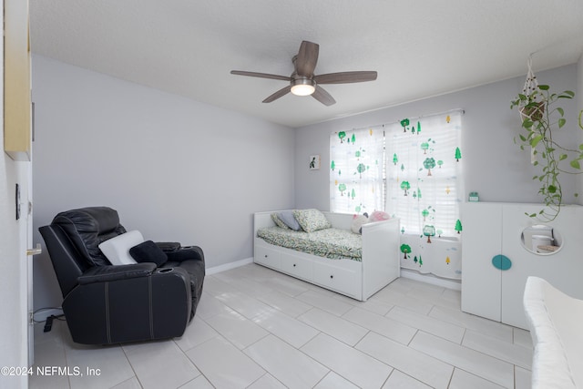 bedroom featuring ceiling fan and light tile patterned floors