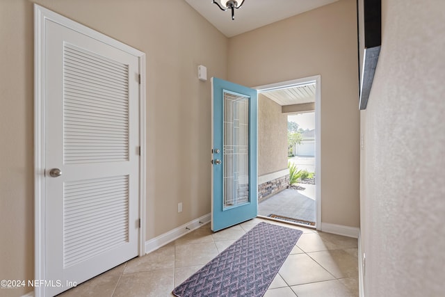 foyer entrance featuring light tile patterned floors