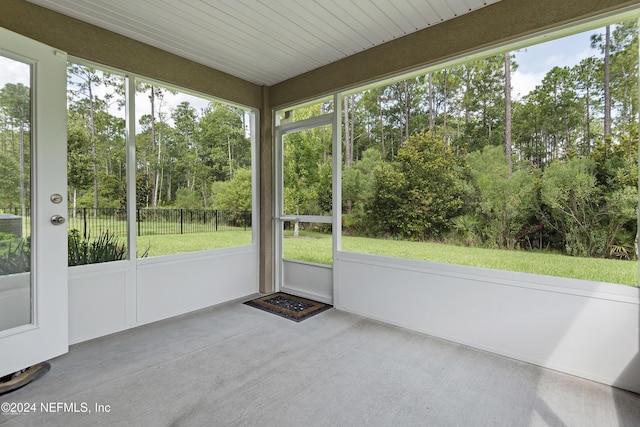 unfurnished sunroom featuring a healthy amount of sunlight