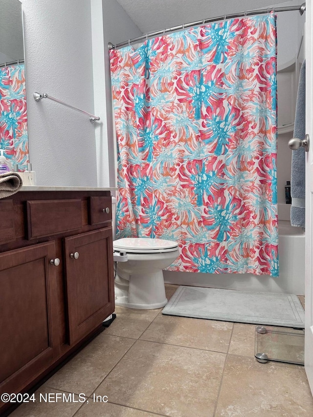 full bathroom with vanity, shower / tub combo, and toilet