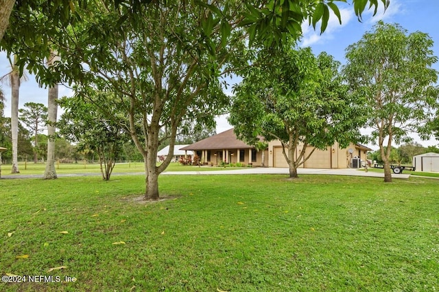 view of yard featuring a garage